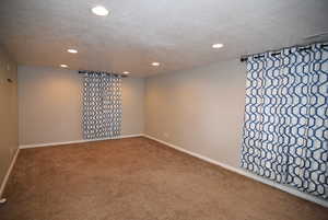 Family Room featuring recessed lighting, carpet floors, a textured ceiling, and baseboards