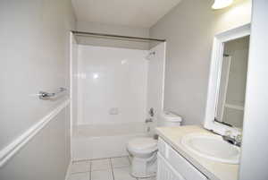 Full bath featuring toilet, vanity, and shower / washtub combination