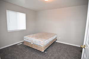 Bedroom #2 Carpeted bedroom with baseboards