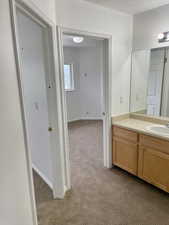 Bathroom featuring vanity and baseboards