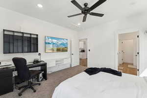 Bedroom with attic access, recessed lighting, carpet floors, an office area, and a ceiling fan