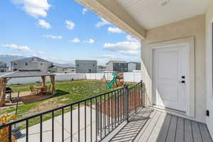 Balcony featuring a residential view and a patio