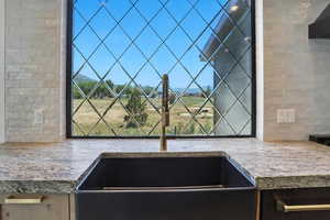 Kitchen view of a sink and backsplash