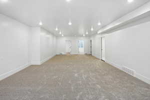 Spare room with recessed lighting and carpet flooring