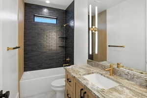 Full bathroom featuring vanity, shower / bath combination, and tile patterned flooring