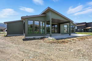 Rear view of house with a patio area