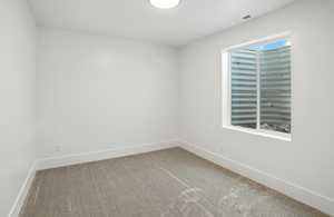 Empty room with carpet flooring