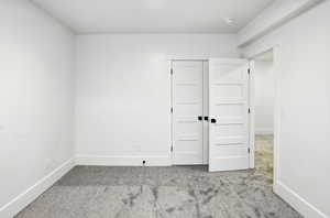 Unfurnished bedroom with carpet