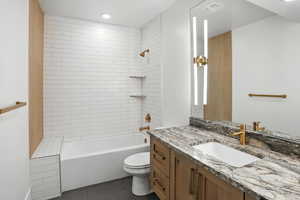 Full bathroom featuring vanity, tile patterned floors, and shower / tub combination