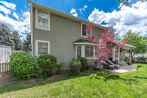 Back of house featuring stucco siding and a patio area