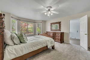 Bedroom featuring carpet floors, ceiling fan, and baseboards