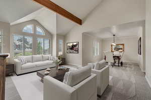 Living room featuring vaulted ceiling, light colored carpet, healthy amount of natural light, and baseboards