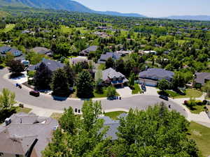 Aerial perspective of suburban area with a mountainous background