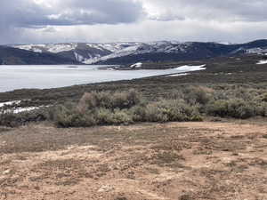 Mountain view featuring a nearby body of water