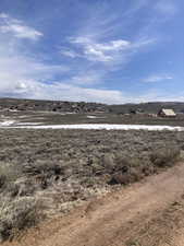 View of yard with a rural view