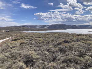 Mountain view featuring a nearby body of water