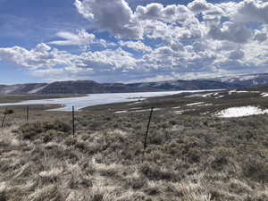 Mountain view featuring a nearby body of water