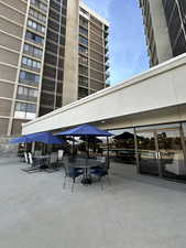 View of pool patio with outdoor dining area.