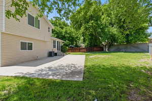 View of yard with a patio area, entry steps, and central AC. Extra large patio for entertaining.