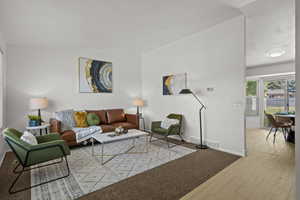 Living room with brand new carpet, and new paint. Vaulted ceilings. Very open and inviting.