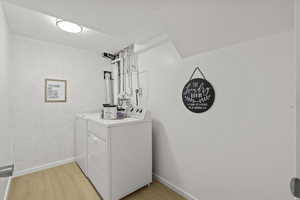 Spacious Laundry Room with plenty of room for baskets and storage. The Washer and Dryer are included!