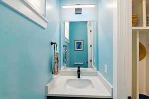 Main floor Half bathroom with vanity