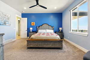 Primary Bedroom with carpet, baseboards, recessed lighting, and ceiling fan