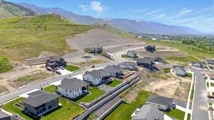 Aerial view of residential area featuring a mountainous background