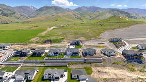 Aerial view of residential area featuring a mountain backdrop