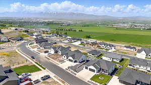 Aerial perspective of suburban area with a mountain backdrop