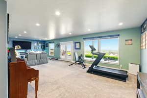 Plenty of room in the basement family room area for exercise equipment or game area.