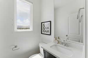 Bathroom featuring toilet and vanity