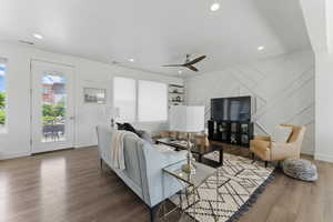 Living area with a ceiling fan, wood finished floors, recessed lighting, and baseboards