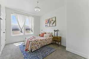Carpeted bedroom with baseboards