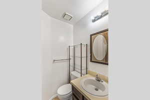 Bathroom with vanity and toilet