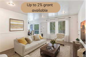 Living area with carpet, plenty of natural light, and recessed lighting