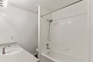 Full bath featuring shower / tub combination and vanity