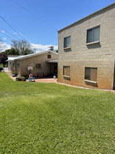 Side & rear view of front apartment and rear apartment/ storage area