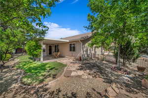 Back of home and covered patio area.