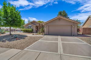 Second view front and garage.  Garage features Epoxy coated flooring.