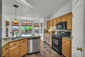 Light and bright kitchen with granite counters, walk in pantry and dining space.