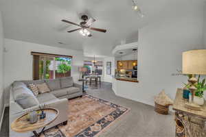 Open floor plan, vaulted ceilings and view to kitchen dining and bar seating.