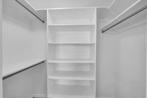 Walk in closet in primary bedroom.