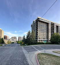 View of building exterior featuring uncovered parking