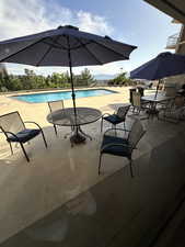 Outdoor pool featuring a patio area
