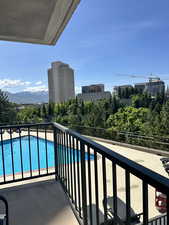 Balcony with view of pool