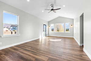 Empty room featuring a ceiling fan, lofted ceiling, wood finished floors, recessed lighting, and baseboards
