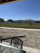 View of grassy yard with a mountain view and a residential view