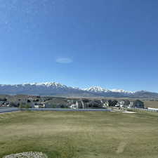 View of mountain backdrop featuring nearby suburban area