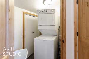 Laundry room with estacked washer and dryer